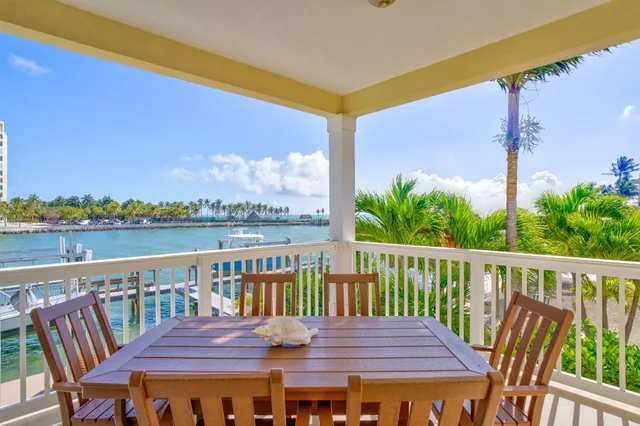 a bedroom with a large bed and a large window