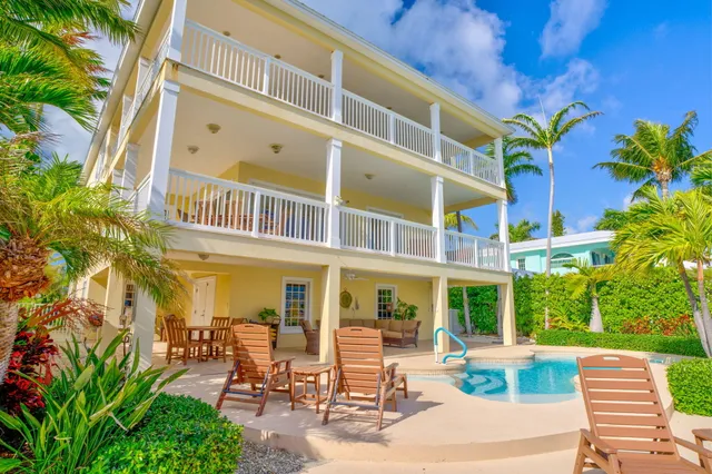 a spacious bathroom with a granite countertop tub sink and mirror