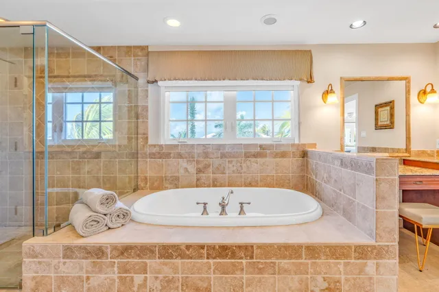 a view of a hallway with wooden floor and door