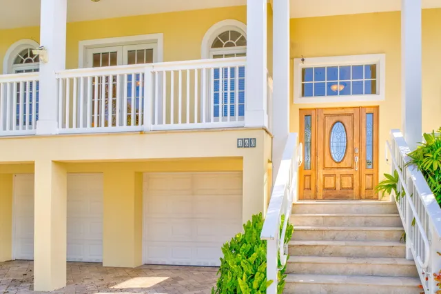 a living room with furniture a rug and a chandelier
