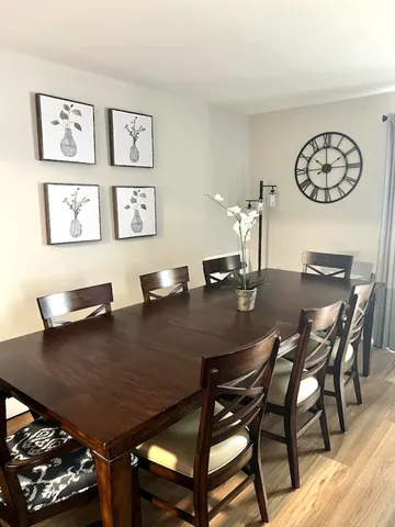 a view of a dining room with furniture and a table