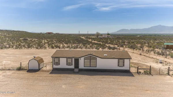 a front view of a house with a ocean view