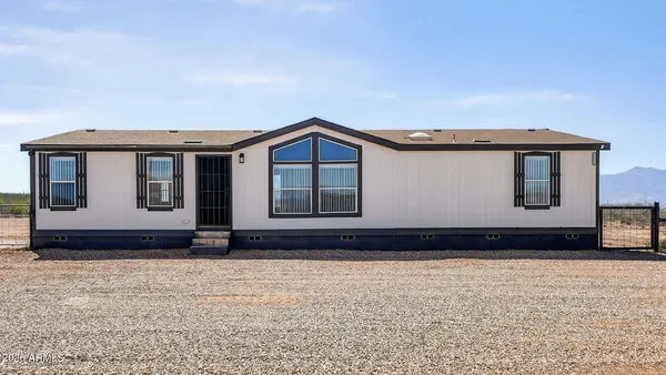 a house with trees in the background