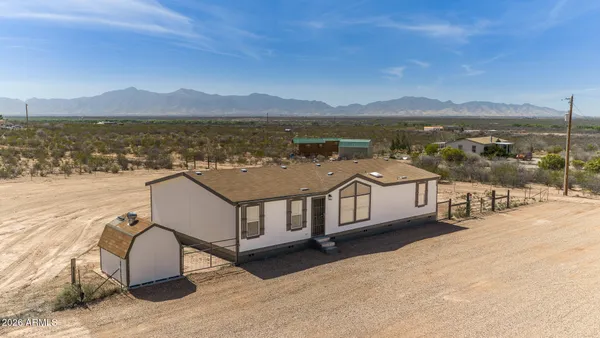 a view of a terrace with a table and chairs