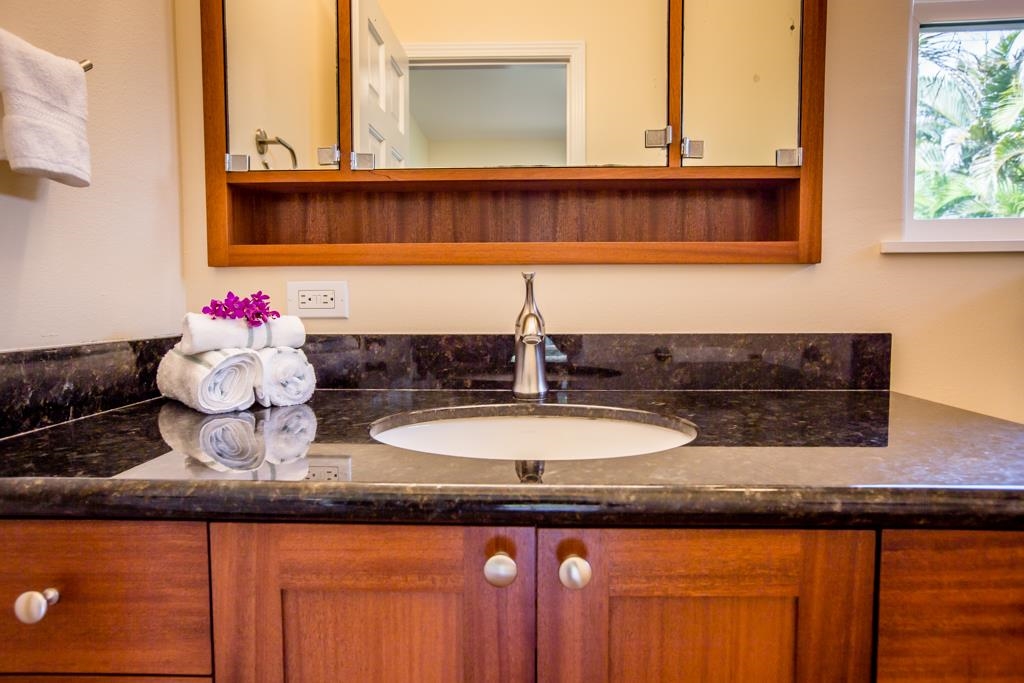 60 Nohea Place, Unit B Haiku, HI 96708 - Photo 17 of 30 a bathroom with a sink and a mirror