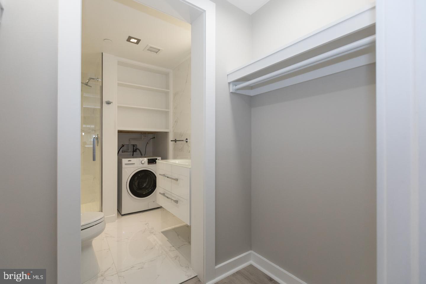 1602 Sansom Street, Unit 2 Philadelphia, PA 19103 - Photo 12 of 18 a utility room with dryer and washer