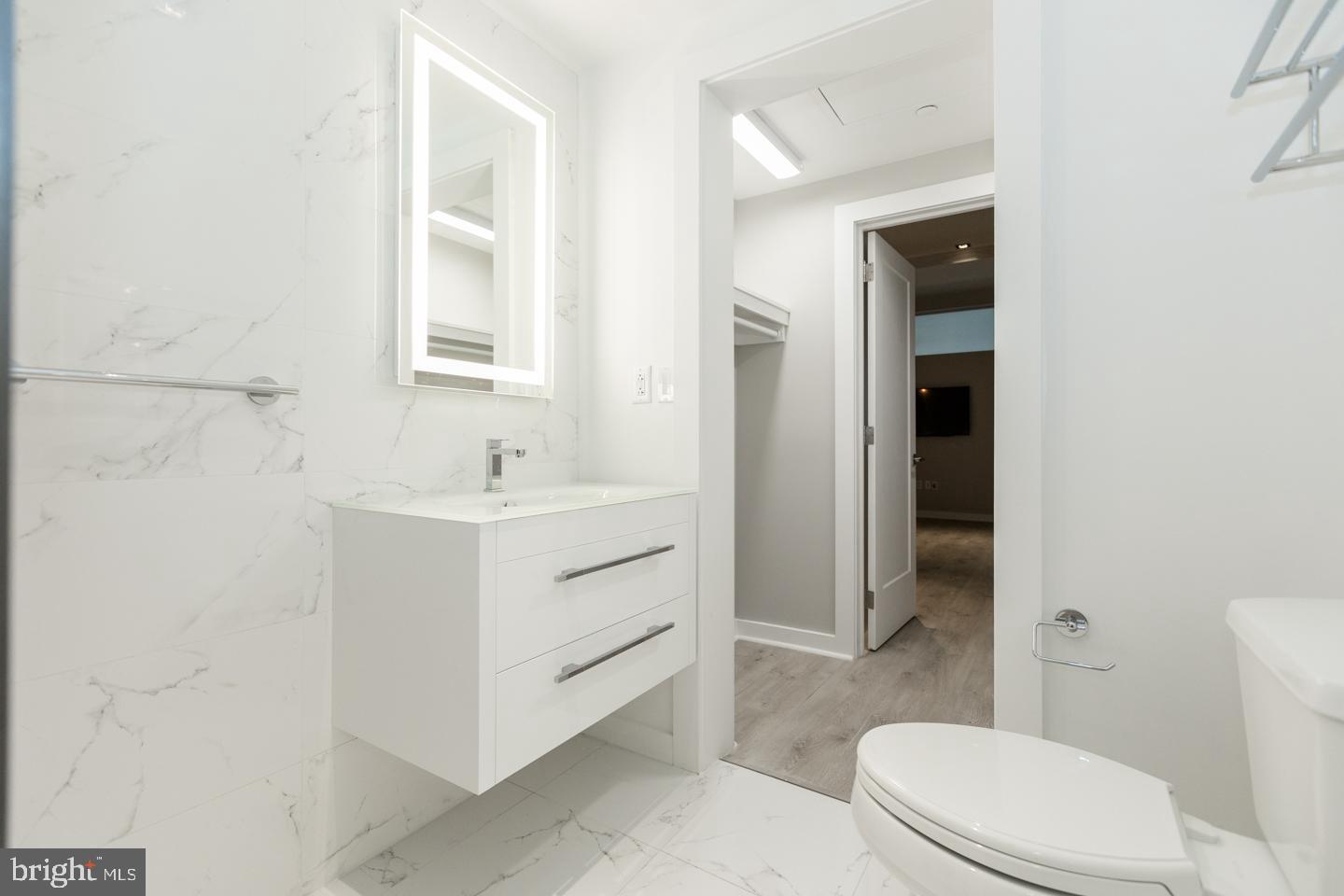 1602 Sansom Street, Unit 2 Philadelphia, PA 19103 - Photo 15 of 18 a bathroom with a sink a toilet and shower