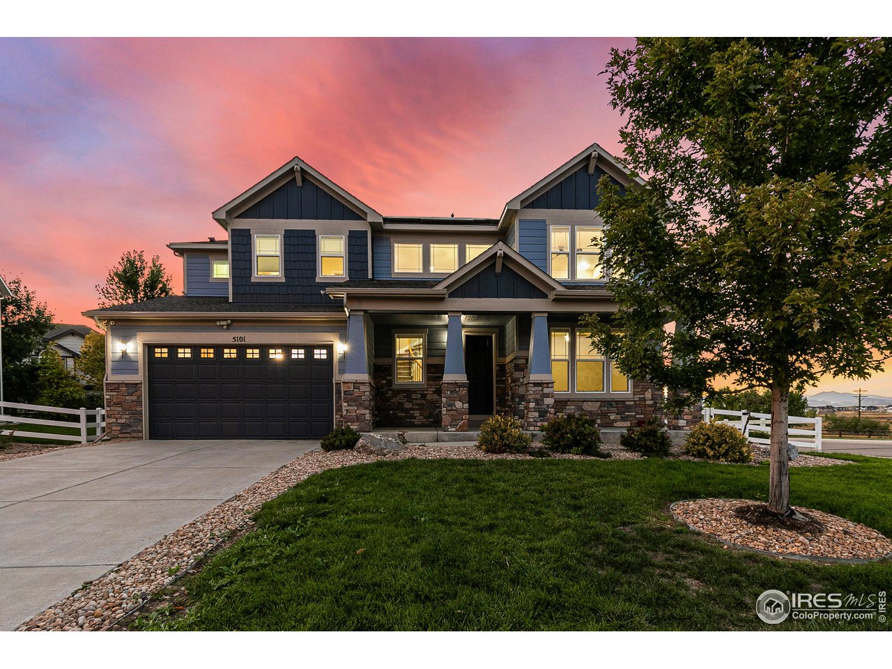 5101 Eagan Circle Longmont, CO 80503 - Photo 1 of 39 a front view of a house with a yard