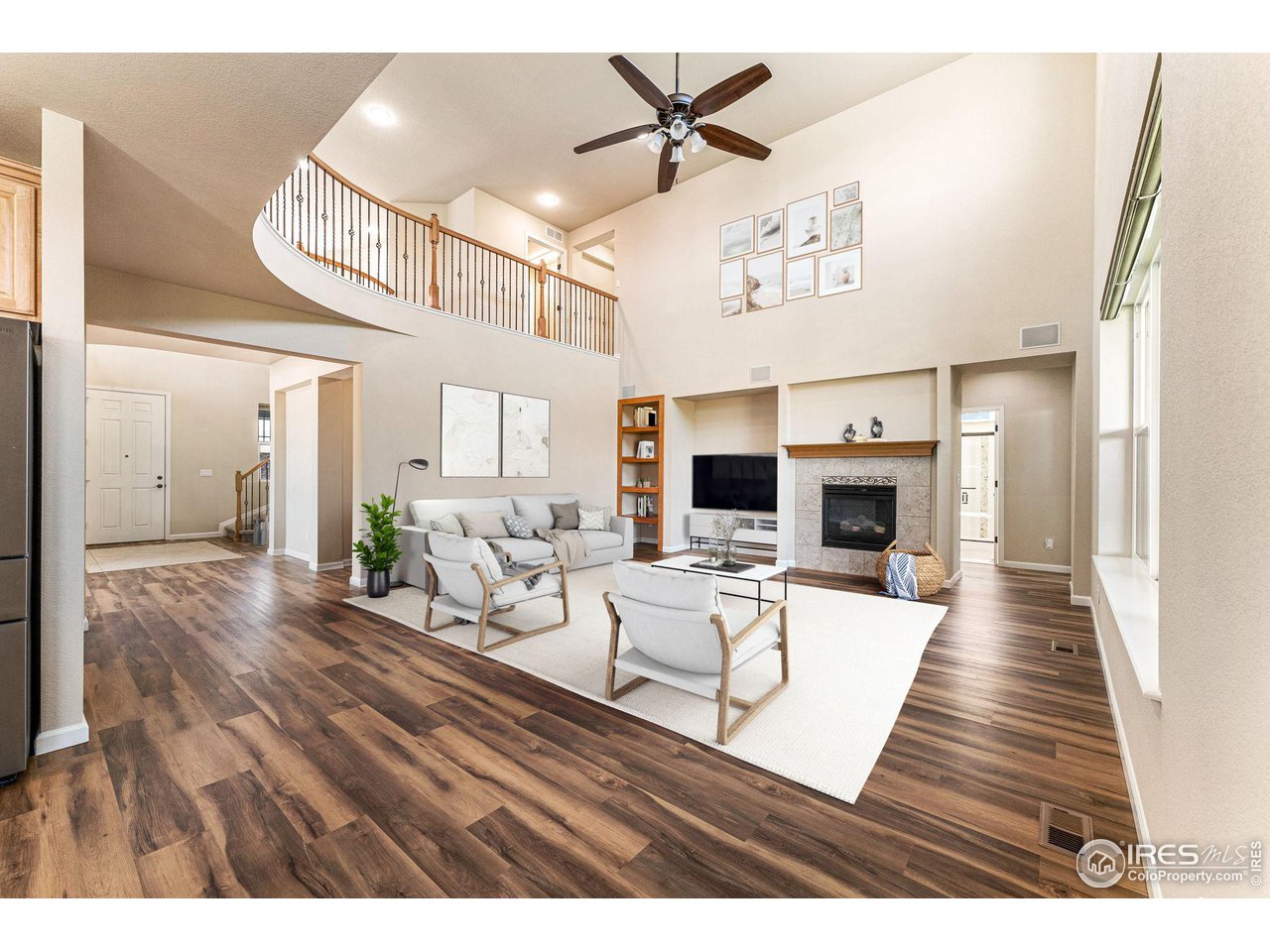 5101 Eagan Circle Longmont, CO 80503 - Photo 13 of 39 a living room with furniture and a flat screen tv