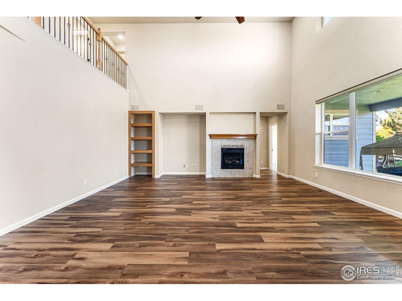 5101 Eagan Circle Longmont, CO 80503 - Photo 14 of 39 a view of empty room with wooden floor and fan