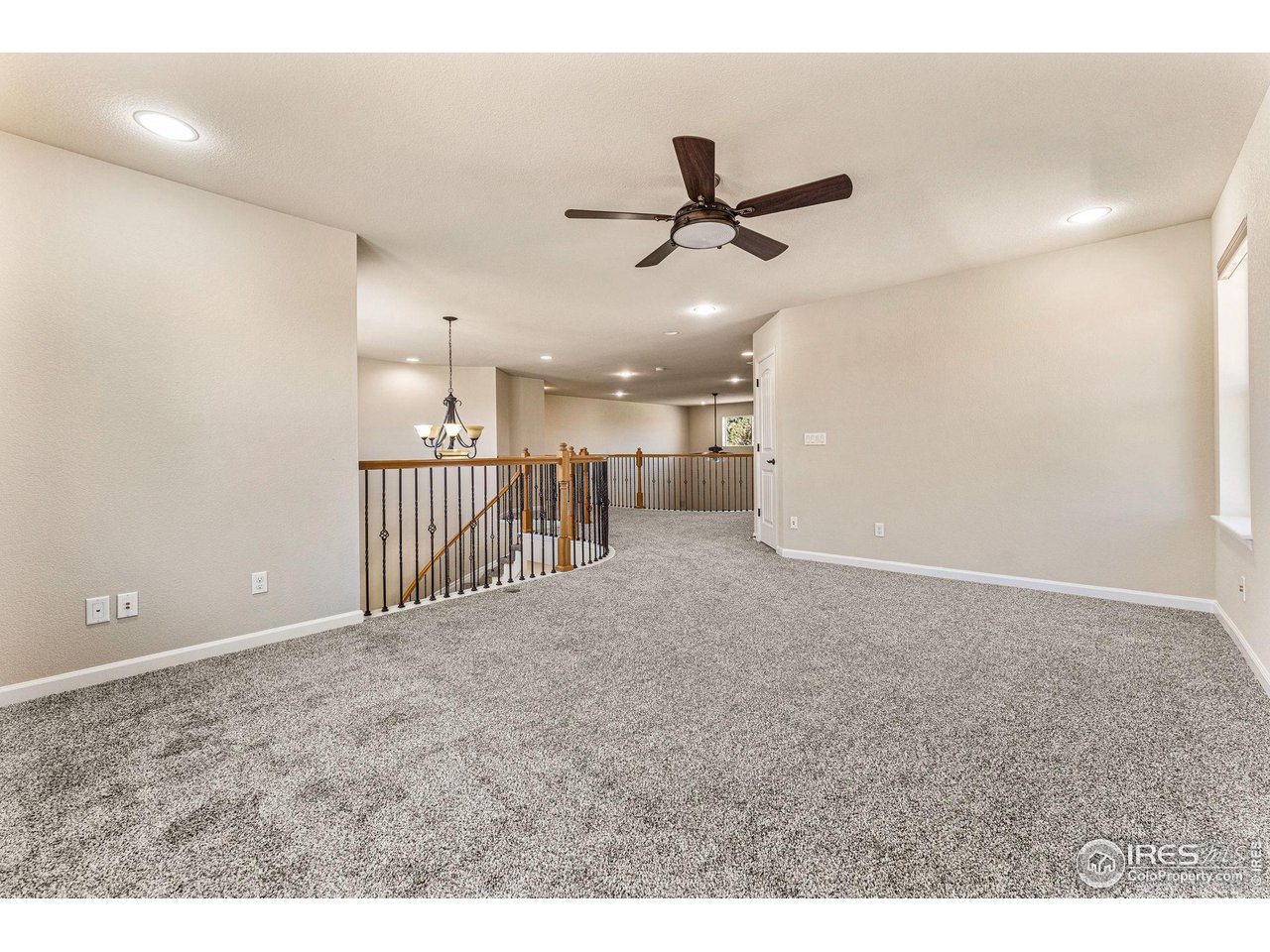 5101 Eagan Circle Longmont, CO 80503 - Photo 18 of 39 a view of a livingroom with a ceiling fan and entryway