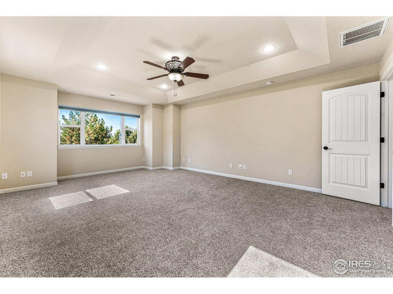 5101 Eagan Circle Longmont, CO 80503 - Photo 20 of 39 a view of an empty room with a window