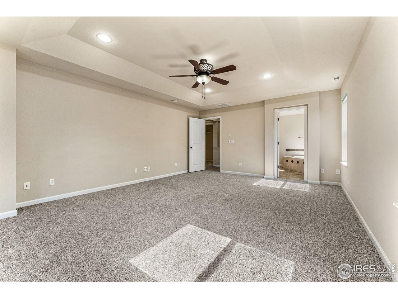 5101 Eagan Circle Longmont, CO 80503 - Photo 22 of 39 a view of an empty room with a ceiling fan