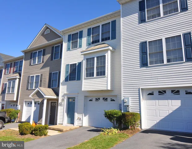 a front view of a house with yard