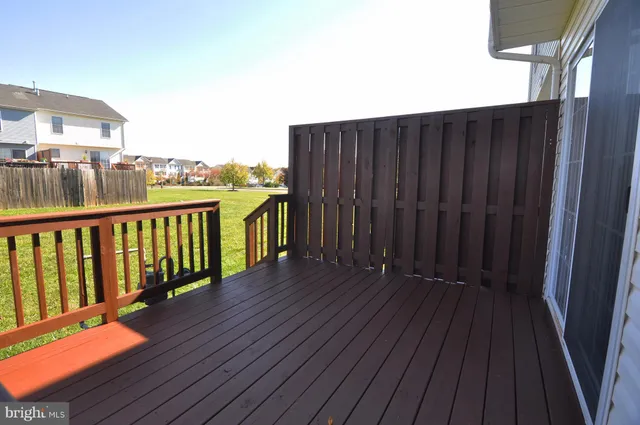 a view of balcony with wooden floor