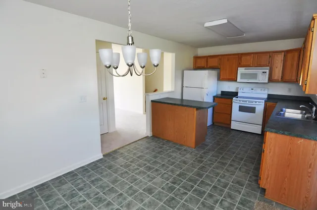 an empty room with furniture and a window