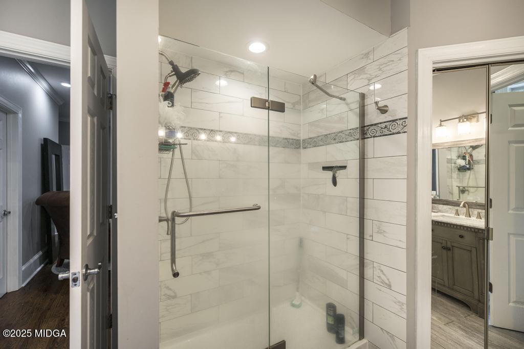 2489 Boxankle Road Forsyth, GA 31029 - Photo 33 of 68 a bathroom with a shower and a glass door