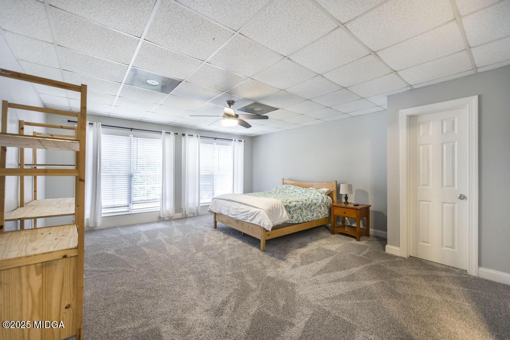 2489 Boxankle Road Forsyth, GA 31029 - Photo 44 of 68 a spacious bedroom with a bed and a large window