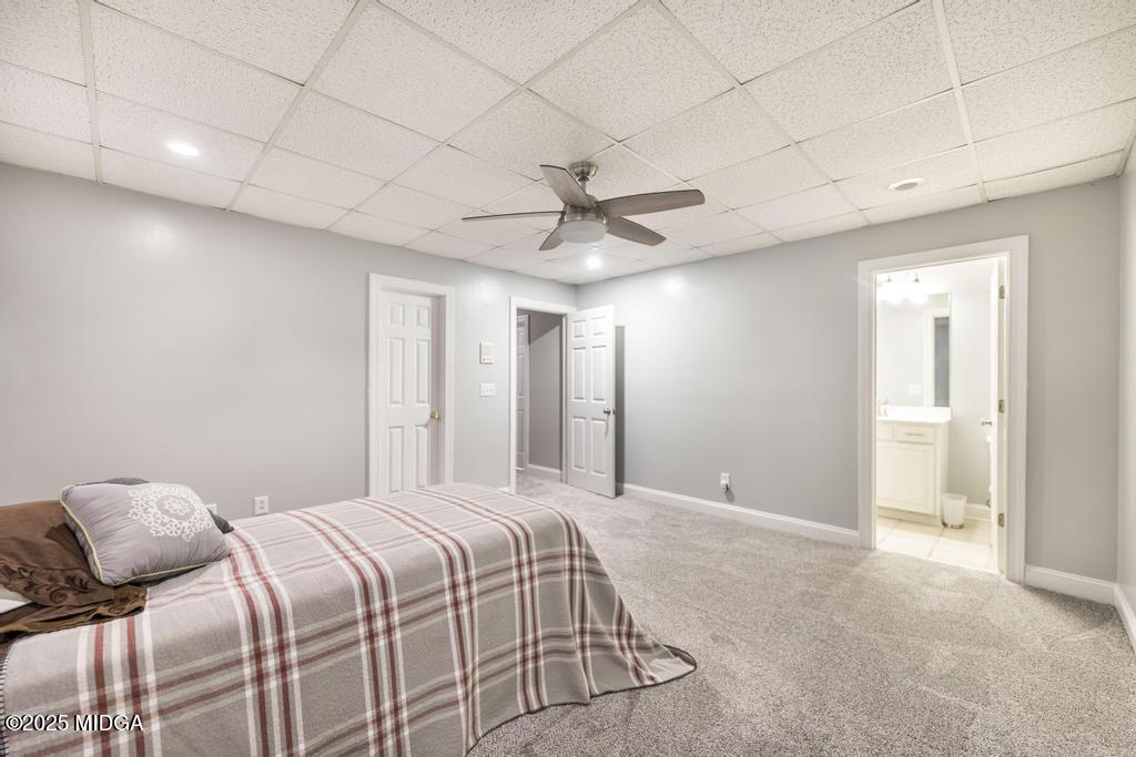 2489 Boxankle Road Forsyth, GA 31029 - Photo 45 of 68 a bedroom with a bed and a ceiling fan