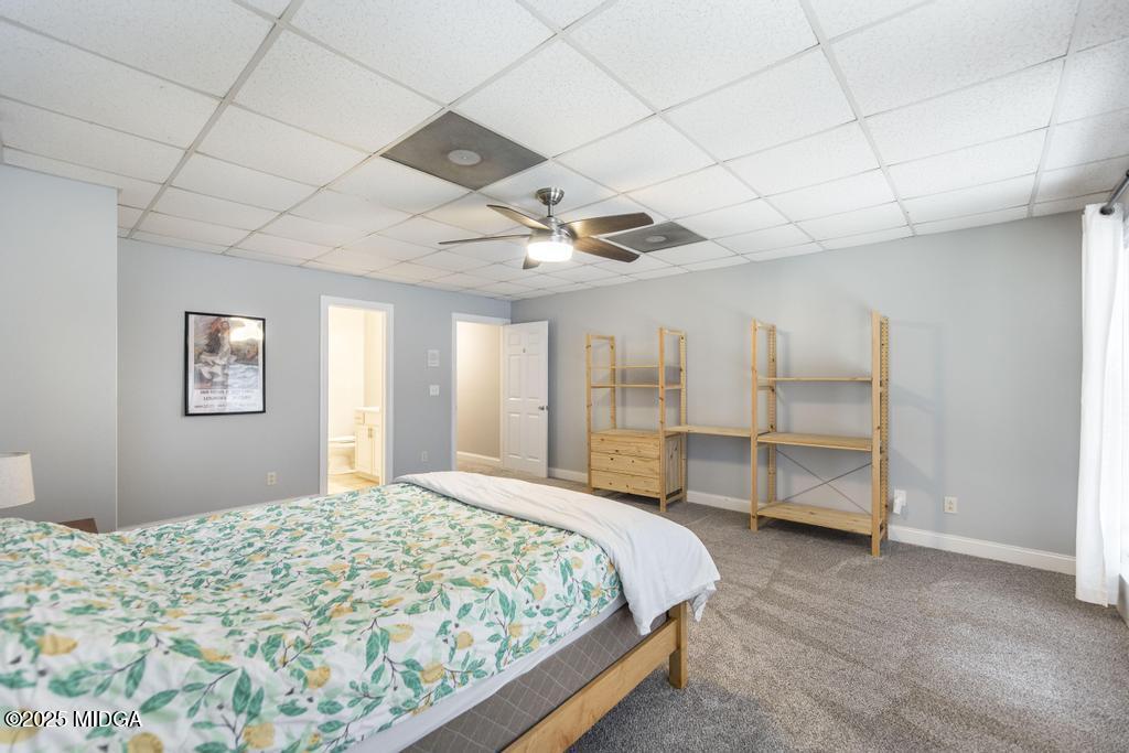 2489 Boxankle Road Forsyth, GA 31029 - Photo 50 of 68 a spacious bedroom with a bed and a cabinets