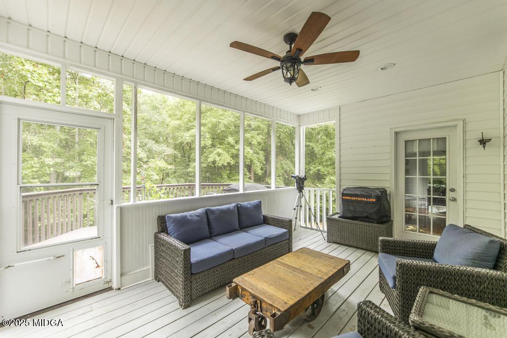 2489 Boxankle Road Forsyth, GA 31029 - Photo 51 of 68 a living room with furniture and a large window