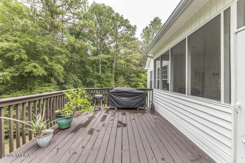 2489 Boxankle Road Forsyth, GA 31029 - Photo 52 of 68 a view of a wooden deck with a table and chairs