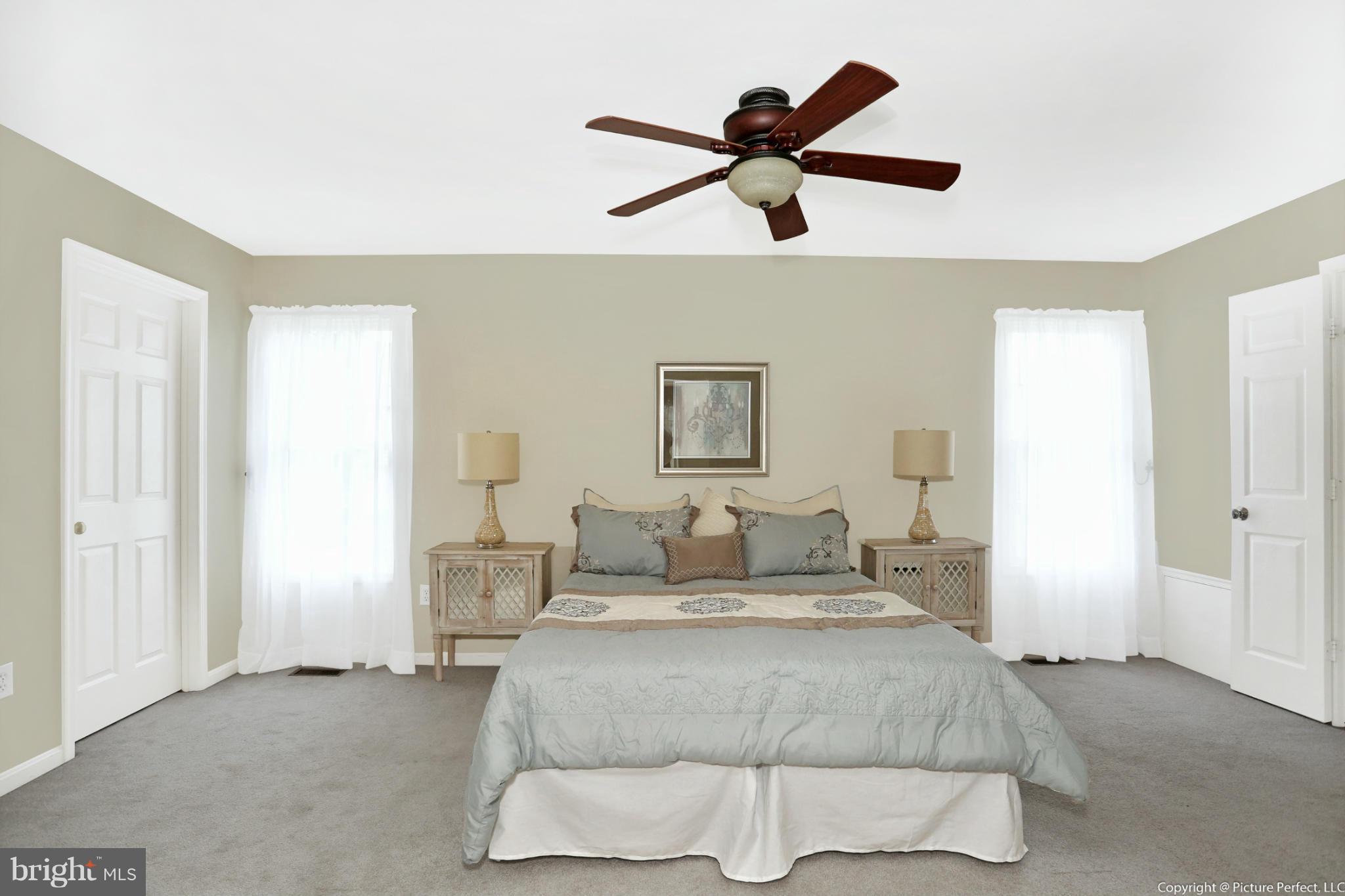1721 Canal Run Drive Point of Rocks, MD 21777 - Photo 14 of 30 a bedroom with a bed and a ceiling fan