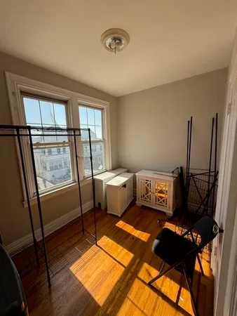 a bedroom with furniture and a window