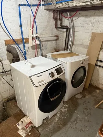 a utility room with dryer and washer