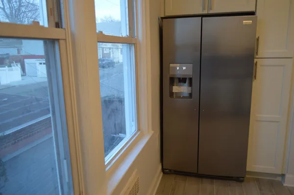 a bathroom with a glass shower door
