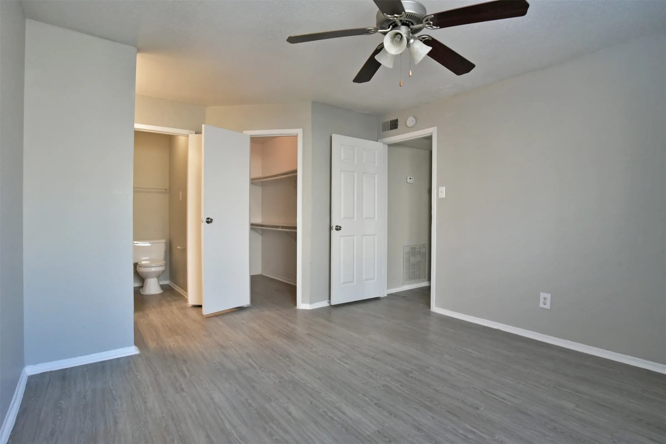 2700 South Dairy Ashford Road, Unit 610D Houston, TX 77082 - Photo 15 of 15 a view of an empty room and wooden floor