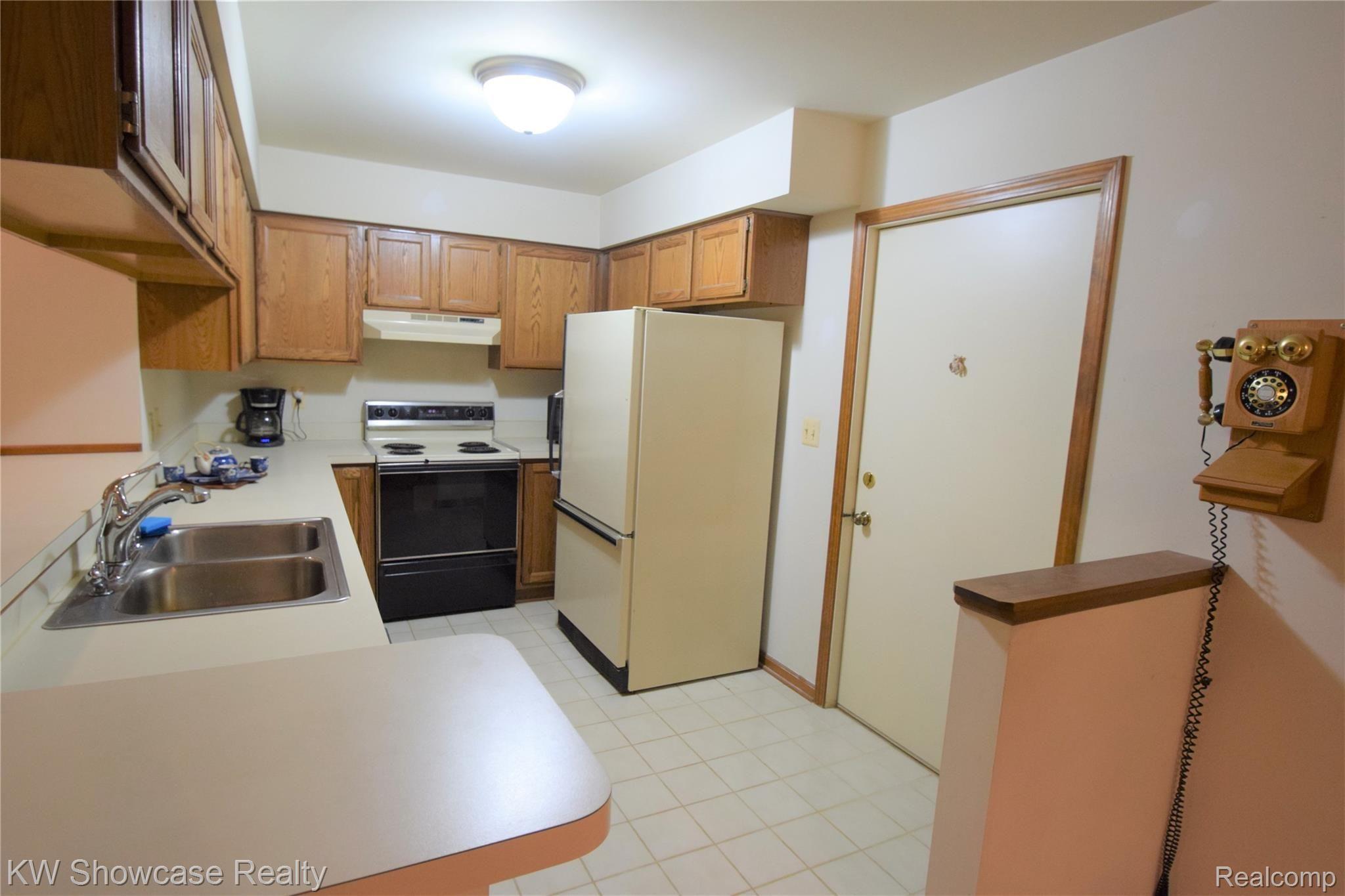 6720 Cedar Lake Road Pinckney, MI 48169 - Photo 22 of 50 Kitchen, door leading to attached garage