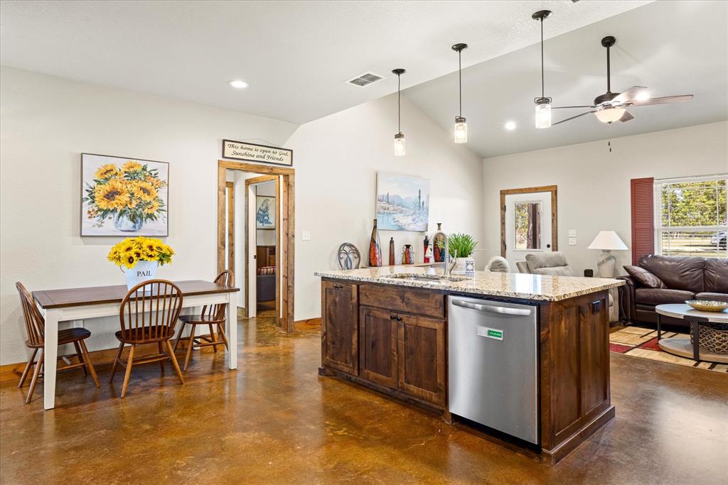 3761 County Road 149 Bluff Dale, TX 76433 - Photo 11 of 37 a view of a kitchen and dining room