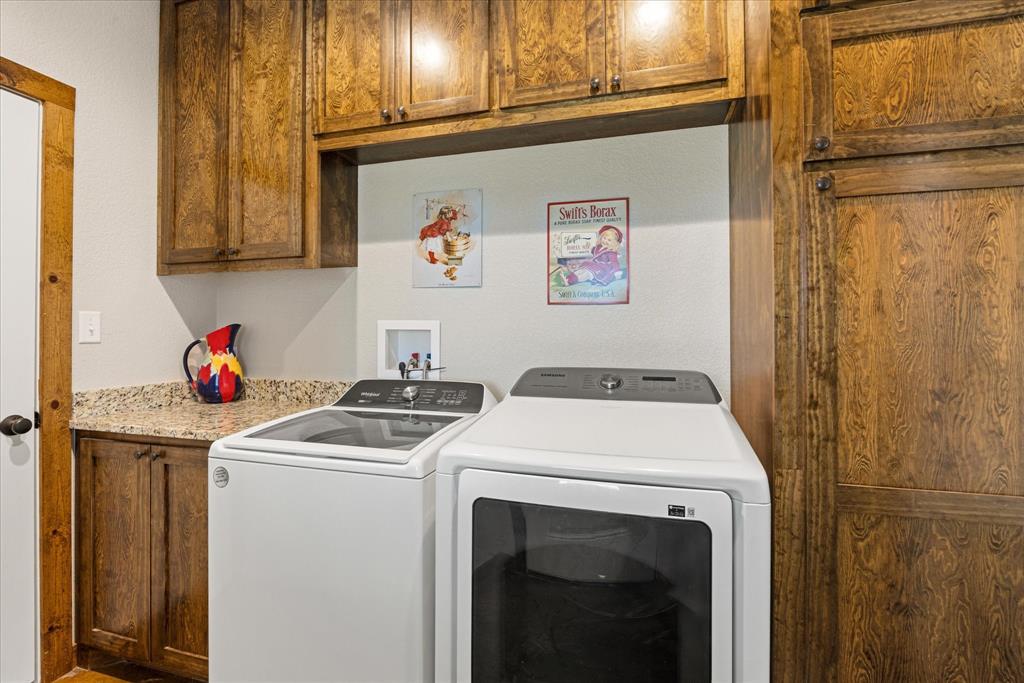 3761 County Road 149 Bluff Dale, TX 76433 - Photo 18 of 37 a utility room with dryer and washer