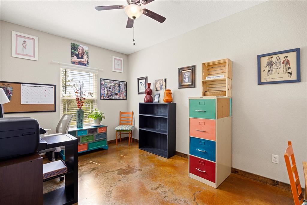 3761 County Road 149 Bluff Dale, TX 76433 - Photo 23 of 37 a view of a livingroom with furniture and workspace