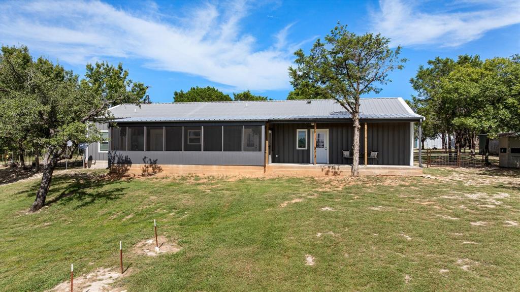 3761 County Road 149 Bluff Dale, TX 76433 - Photo 36 of 37 a view of a house with a swimming pool and sitting area
