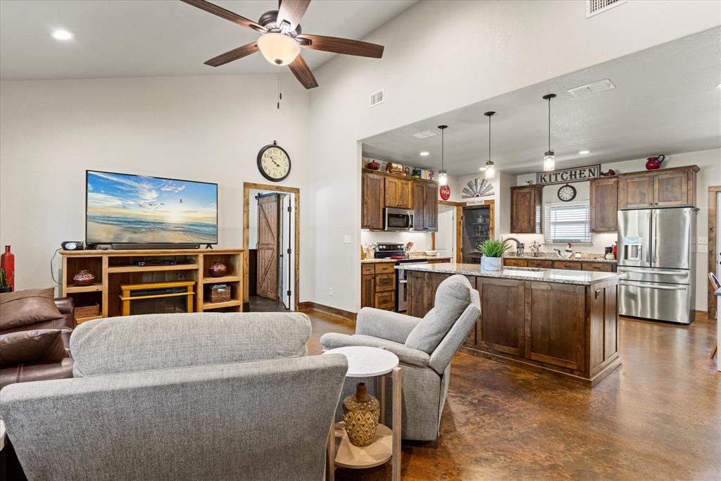 3761 County Road 149 Bluff Dale, TX 76433 - Photo 5 of 37 a living room with furniture and kitchen view