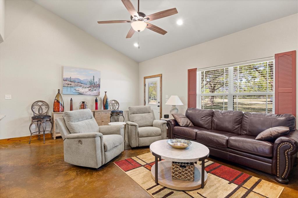 3761 County Road 149 Bluff Dale, TX 76433 - Photo 6 of 37 a living room with furniture and a large window