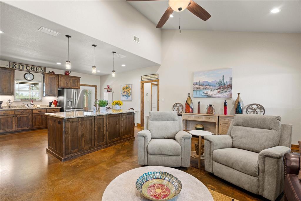 3761 County Road 149 Bluff Dale, TX 76433 - Photo 7 of 37 a living room with furniture and kitchen view