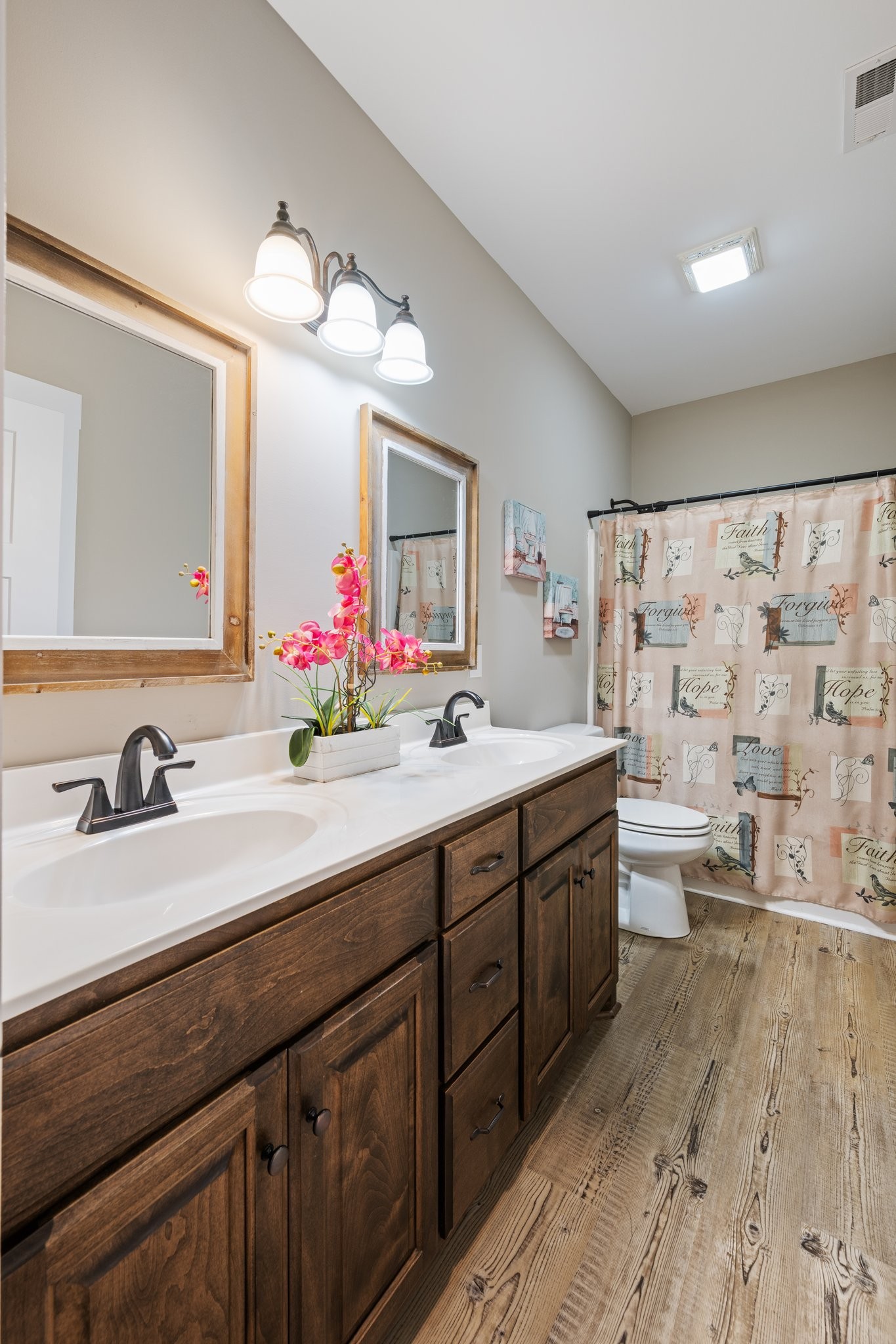 1357 Norton Road Manchester, TN 37355 - Photo 18 of 29 a bathroom with a double vanity sink mirror and toilet