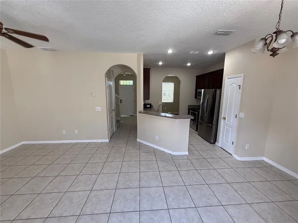 a view of a refrigerator and window in a room