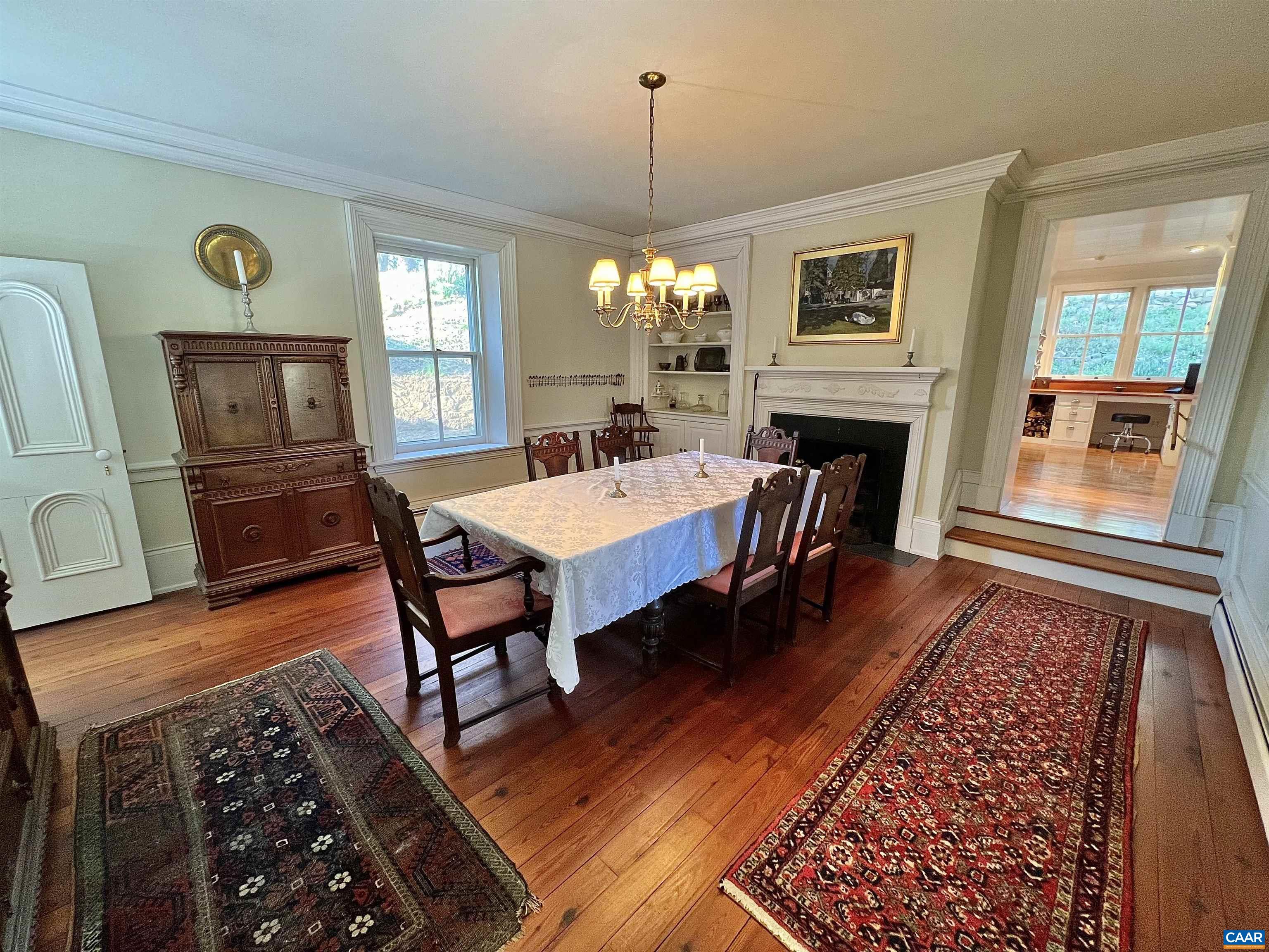 6742 Plank Road Charlottesville, VA 22903 - Photo 19 of 61 a view of a dining room with furniture window and wooden floor