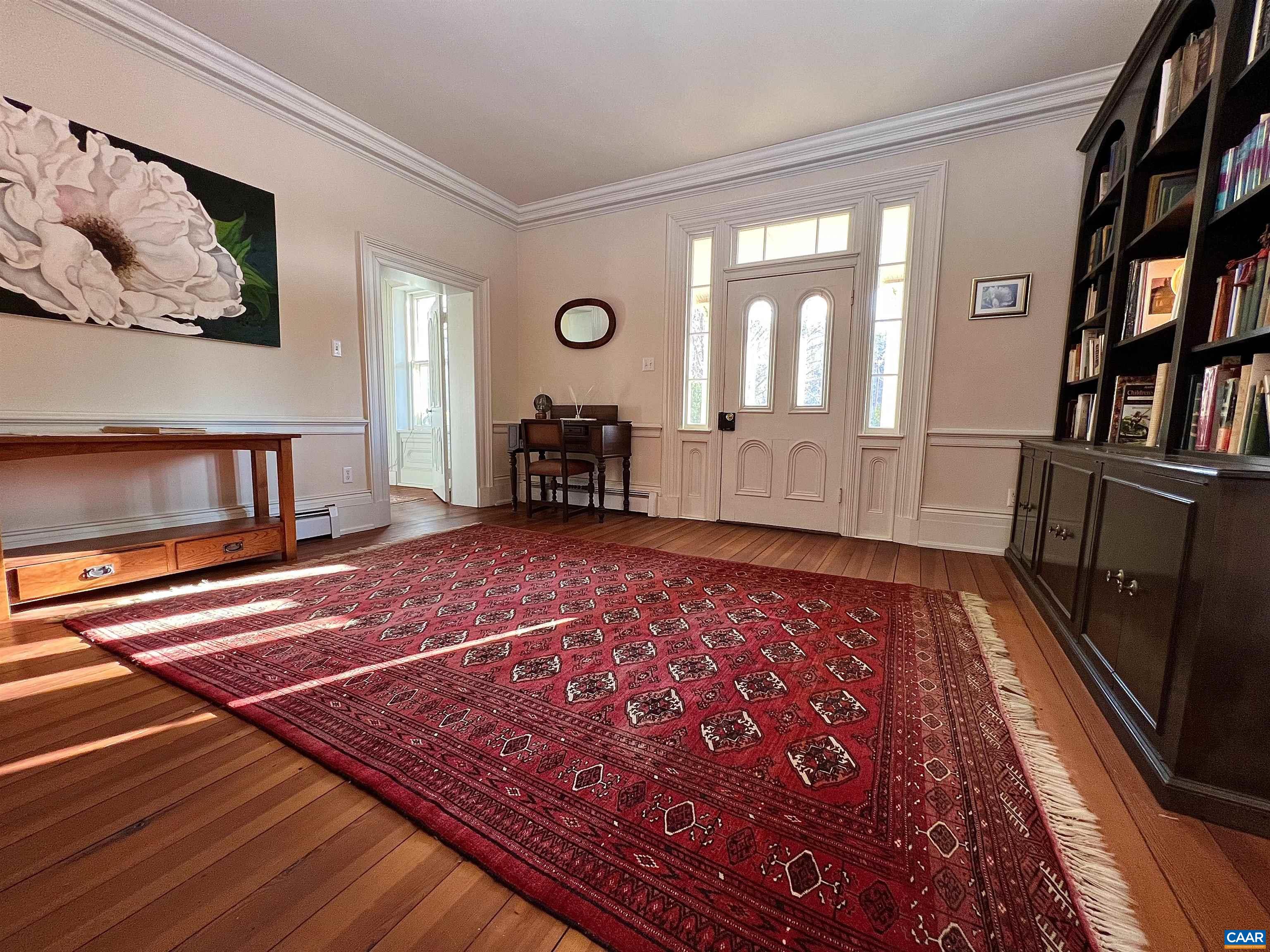 6742 Plank Road Charlottesville, VA 22903 - Photo 22 of 61 a spacious bedroom with a bed and a book shelf