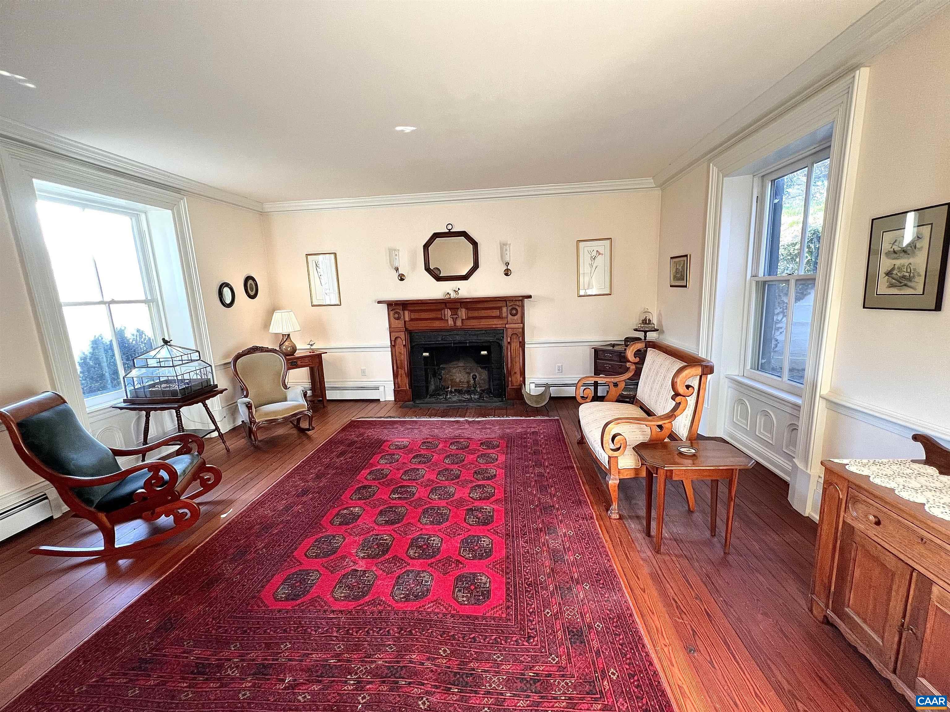 6742 Plank Road Charlottesville, VA 22903 - Photo 23 of 61 a living room with furniture and a fireplace