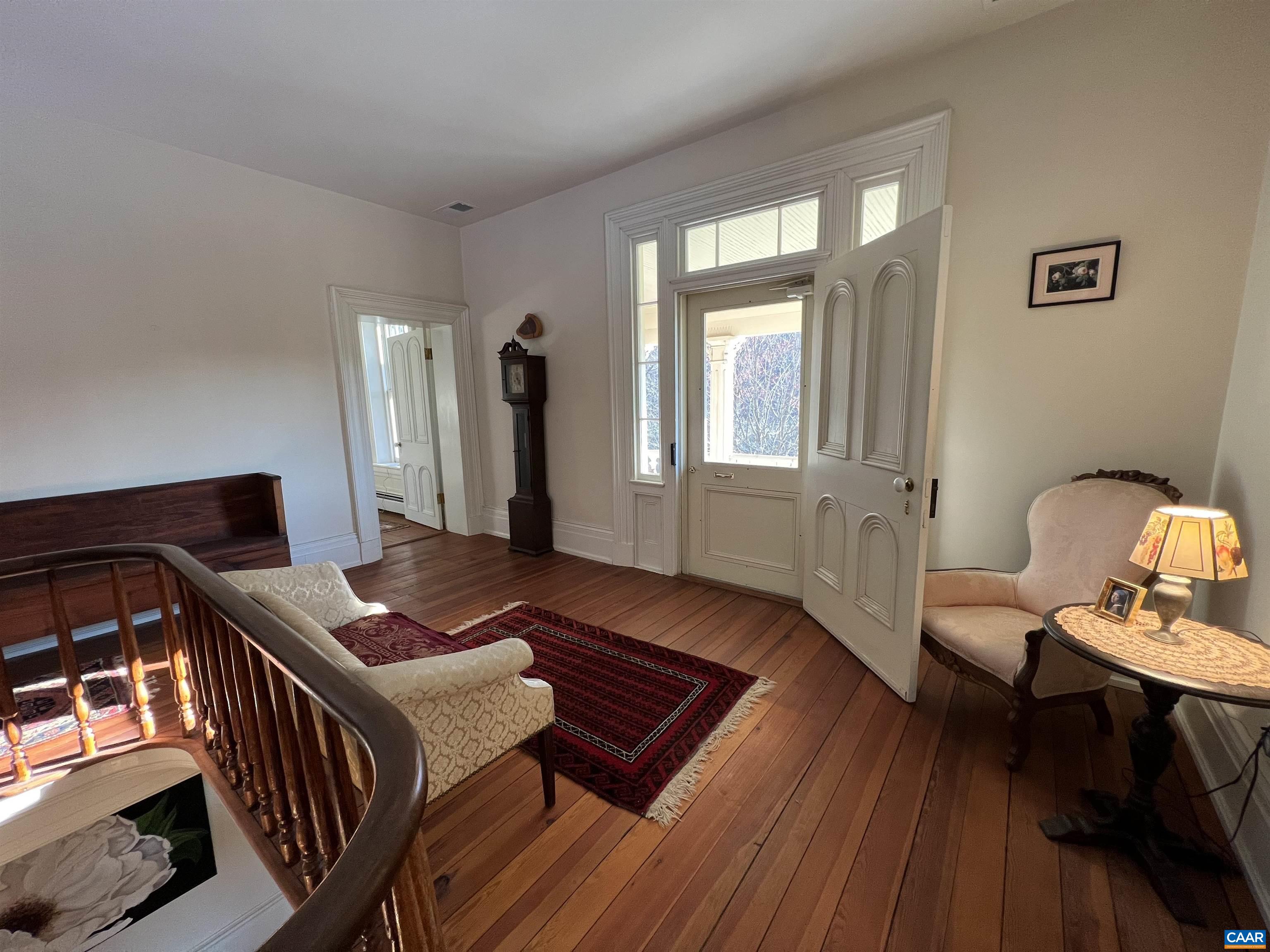 6742 Plank Road Charlottesville, VA 22903 - Photo 26 of 61 a living room with furniture and wooden floor