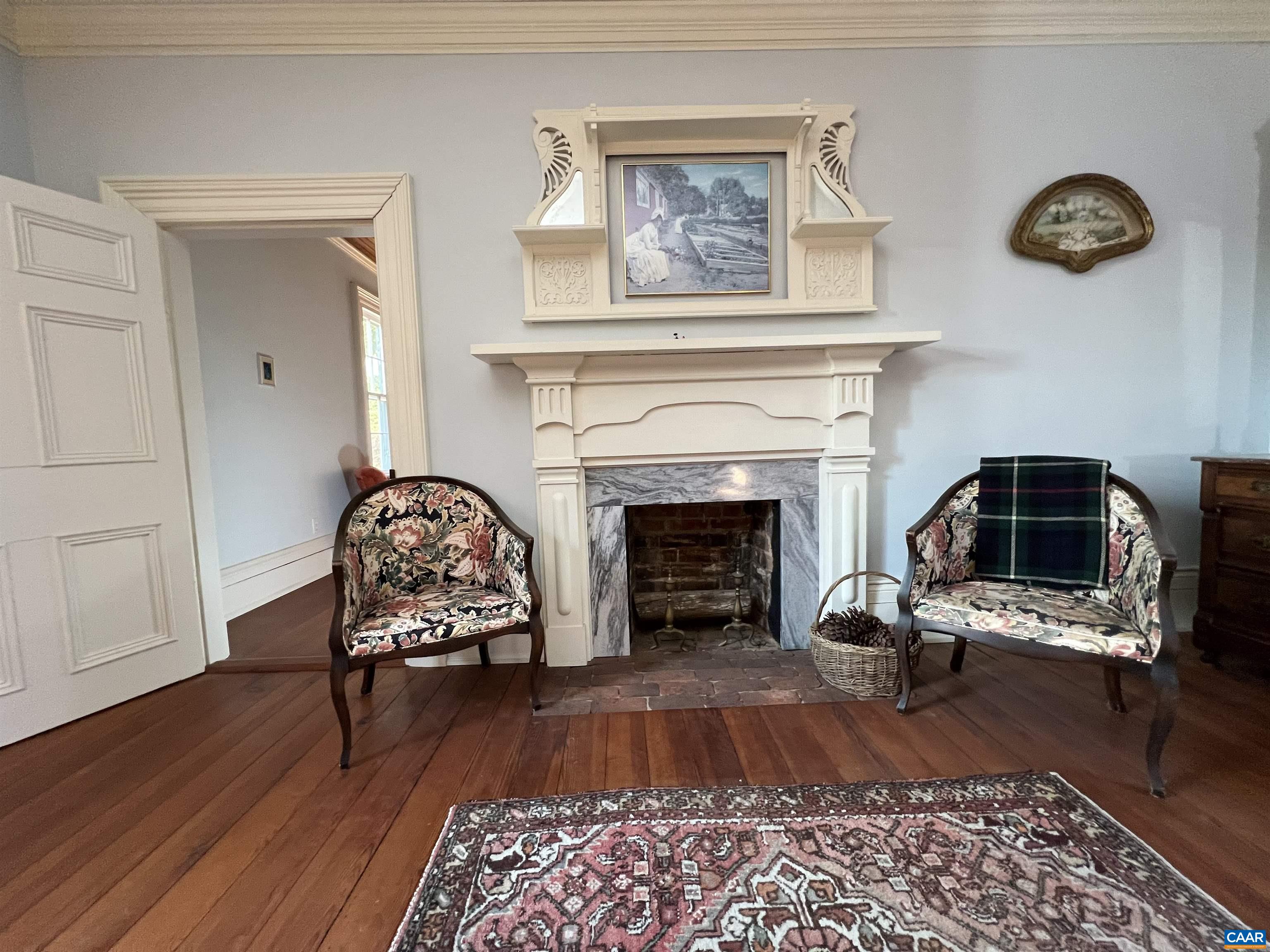 6742 Plank Road Charlottesville, VA 22903 - Photo 33 of 61 a living room with furniture and a fireplace