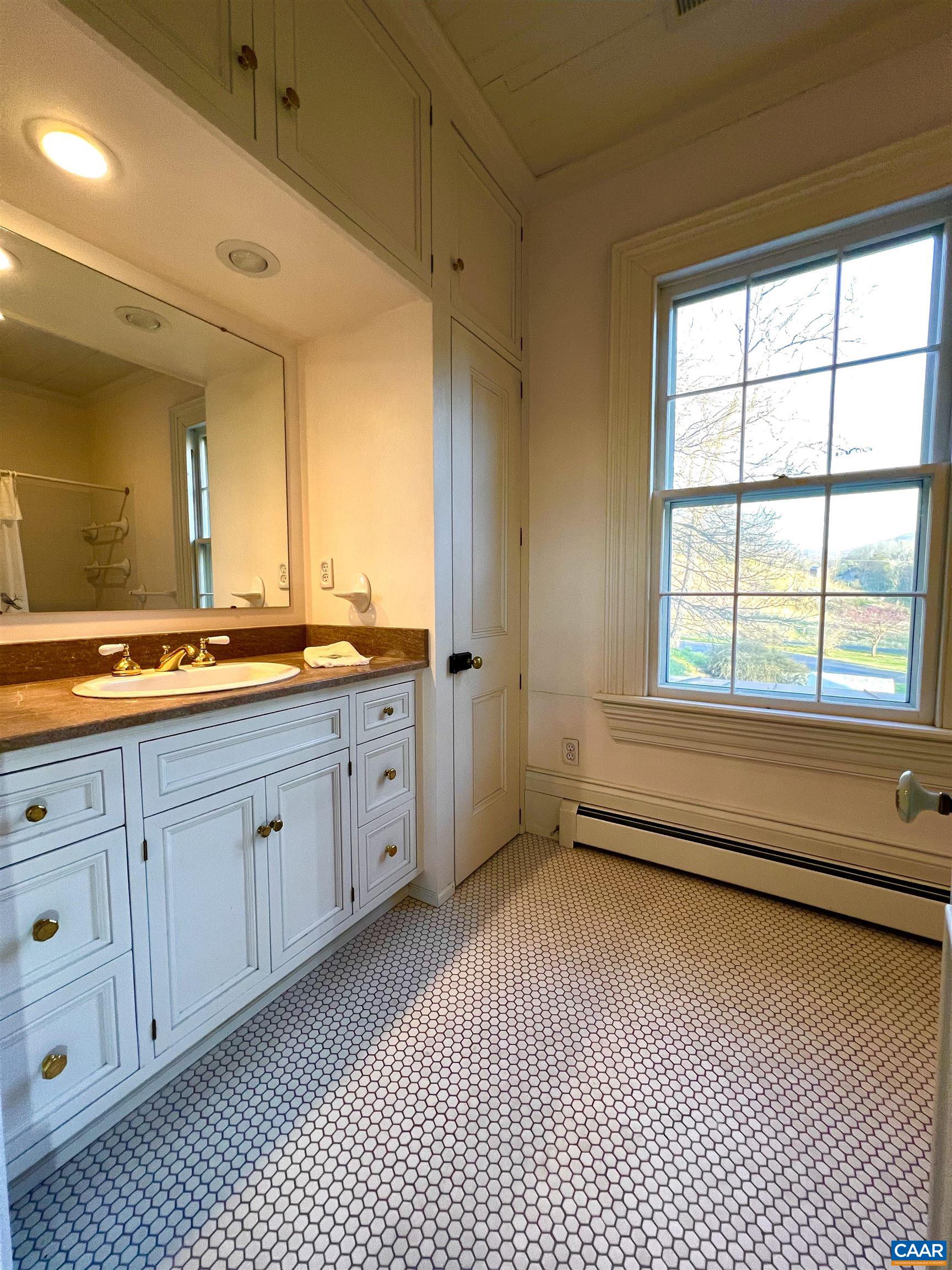 6742 Plank Road Charlottesville, VA 22903 - Photo 36 of 61 a spacious bathroom with a double vanity sink a mirror and a bathtub