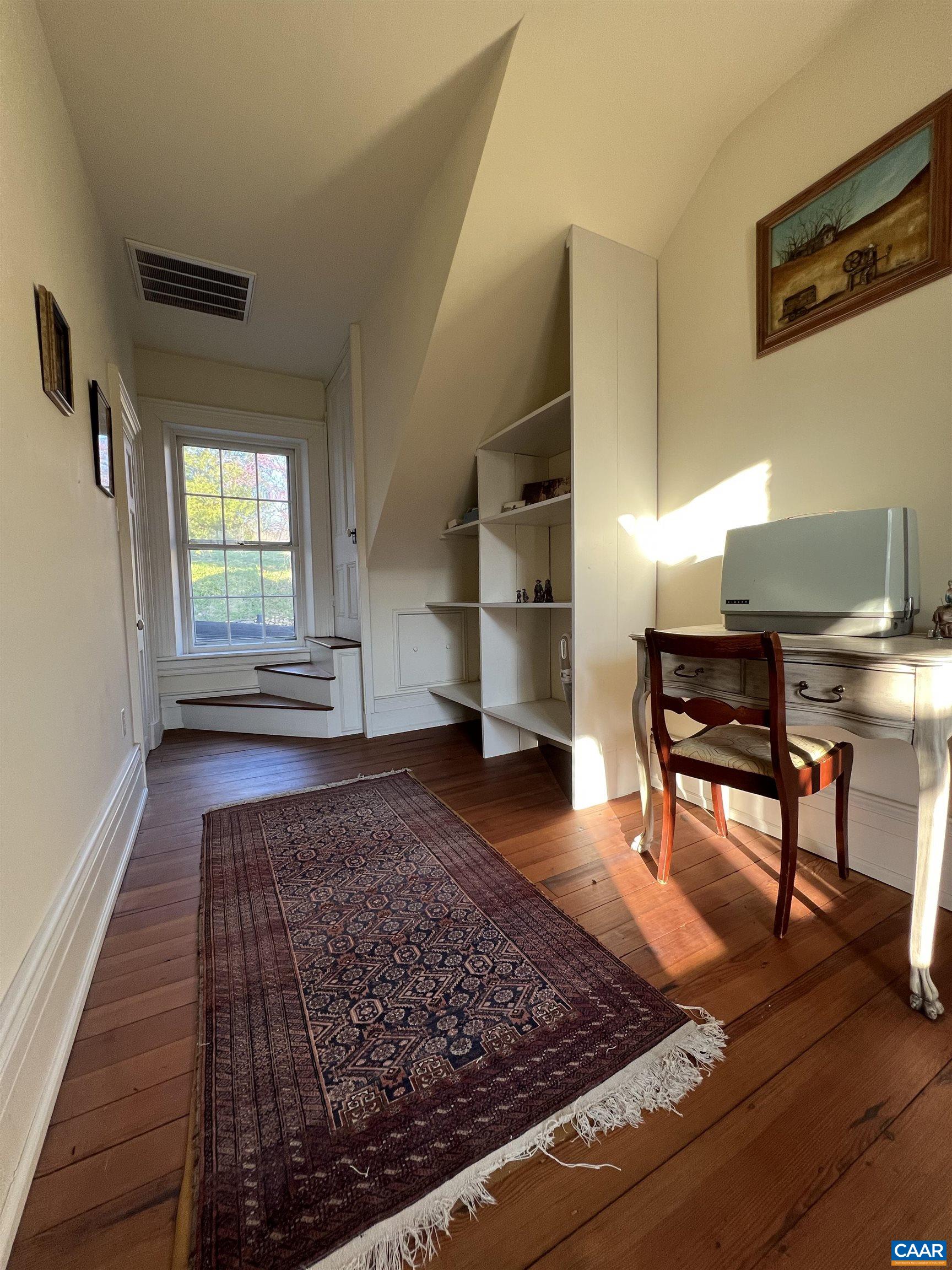6742 Plank Road Charlottesville, VA 22903 - Photo 40 of 61 a living room with furniture and a rug