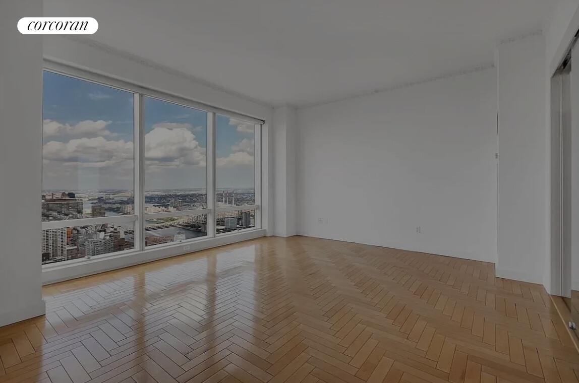 845 United Nations Plaza, Unit 42E Manhattan, NY 10017 - Photo 3 of 10 a view of an empty room with a window