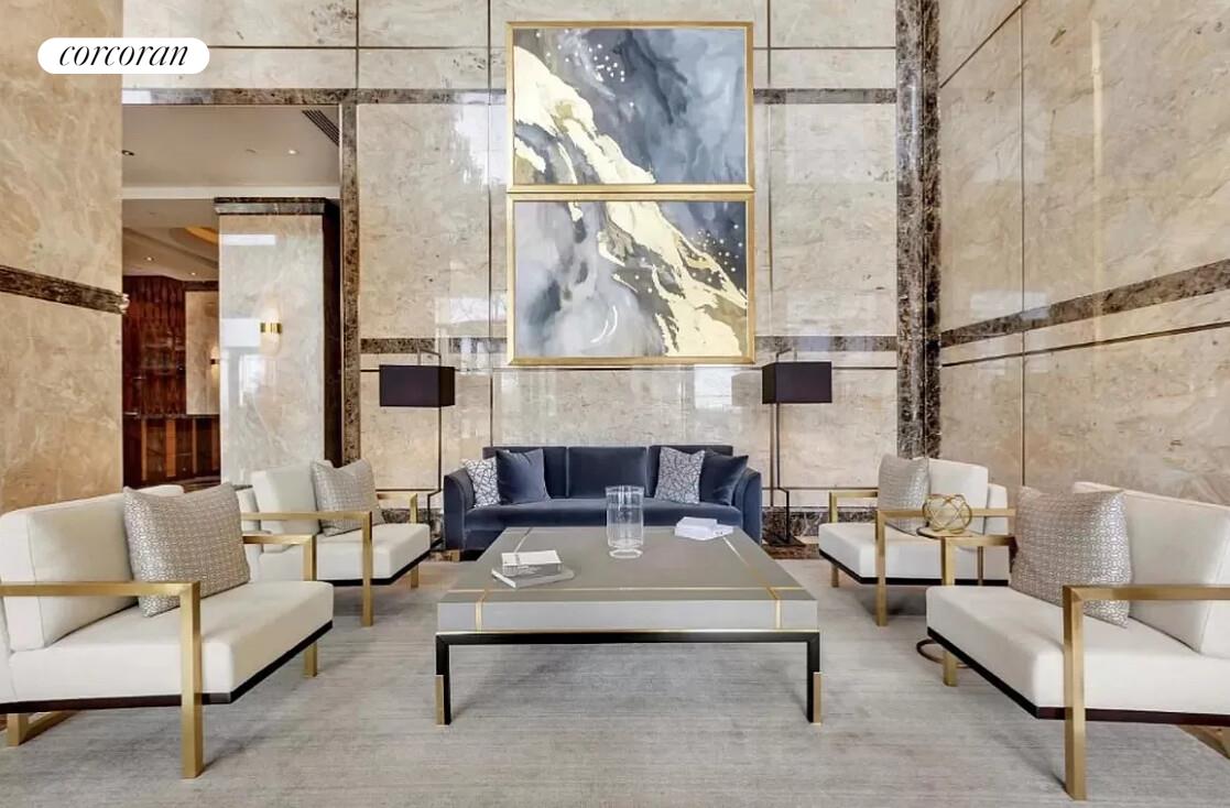 845 United Nations Plaza, Unit 42E Manhattan, NY 10017 - Photo 8 of 10 a living room with furniture and a floor to ceiling window